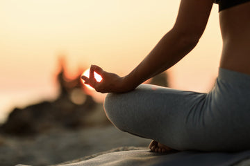 Peaceful woman sitting cross-legged in a serene room, demonstrating what to do during meditation for beginners seeking calm and mindfulness.