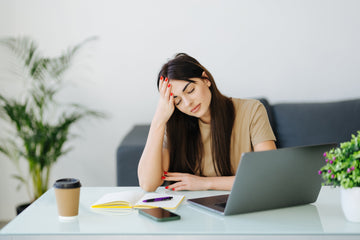 Person using stress management activities like music to relieve stress and manage work anxiety effectively.