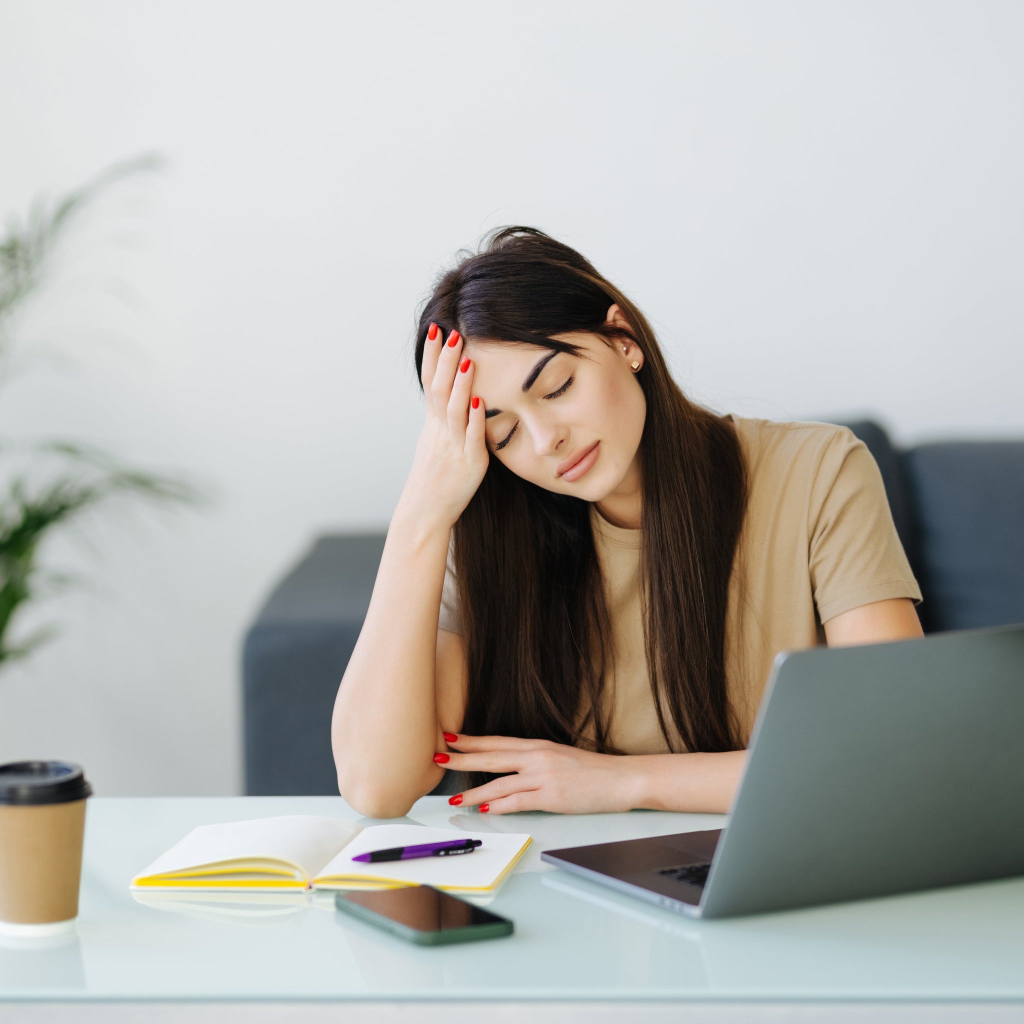 Person using stress management activities like music to relieve stress and manage work anxiety effectively.