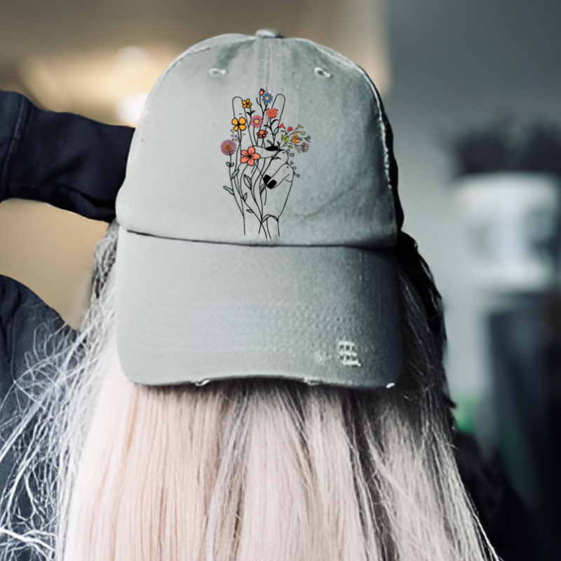 Distressed floral peace sign hippie hat worn by model, perfect accessory for nature lovers and boho enthusiasts.